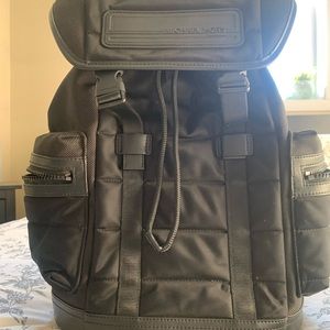 Michael Kors backpack.  Used once for a trip.